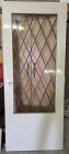 Binnendeur met glas in lood raam. 218X88