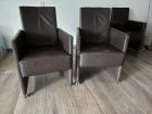 4 lederen stoelen op wieltjes