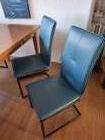 Maximaal 6 turquoise kunstleren eetkamerstoelen